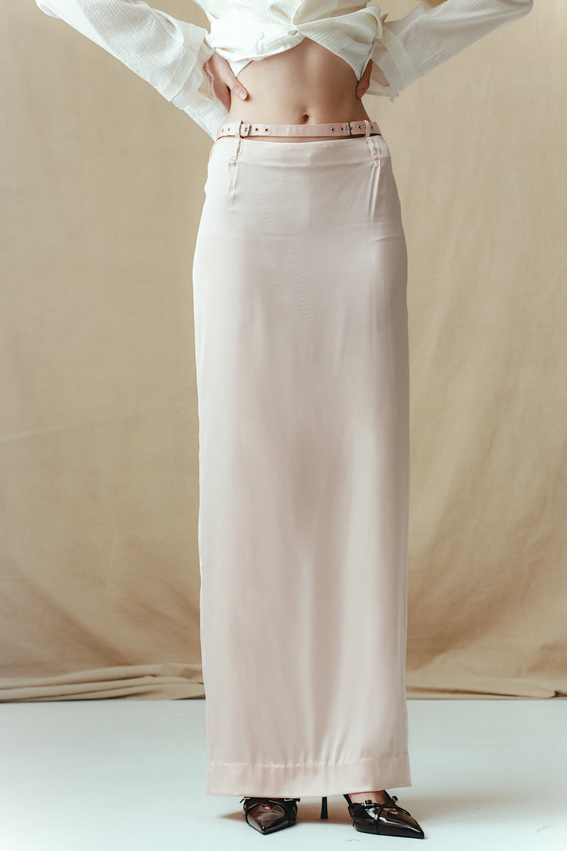 Sean Sheila blush satin maxi skirt with flowing fabric and elegant design, shown in a detailed close-up image.