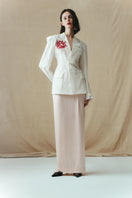 Sean Sheila blush satin maxi skirt, flowing fabric with a sleek, elegant silhouette, shown from the front in the image.