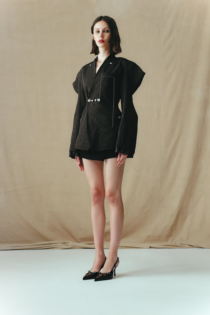 Sean Sheila double-breasted jacket with embellished buttons, shown from the side, featuring tailored fit and stylish design details.