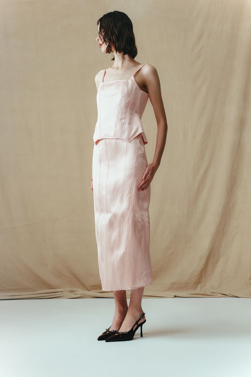 Sean Sheila midi A-line skirt with corset panels, shown from the side, featuring a stylish and structured silhouette.