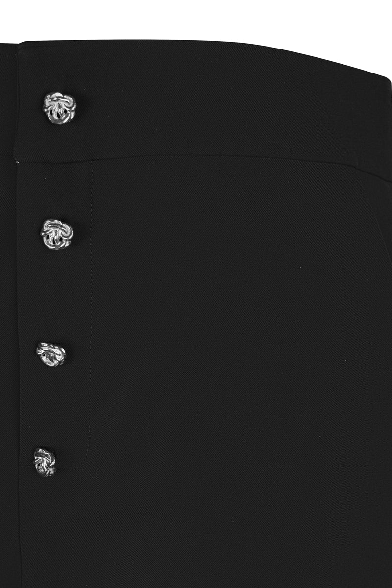 Black cowboy trousers by Sean Sheila with detailed stitching and classic Western style, shown in close-up.