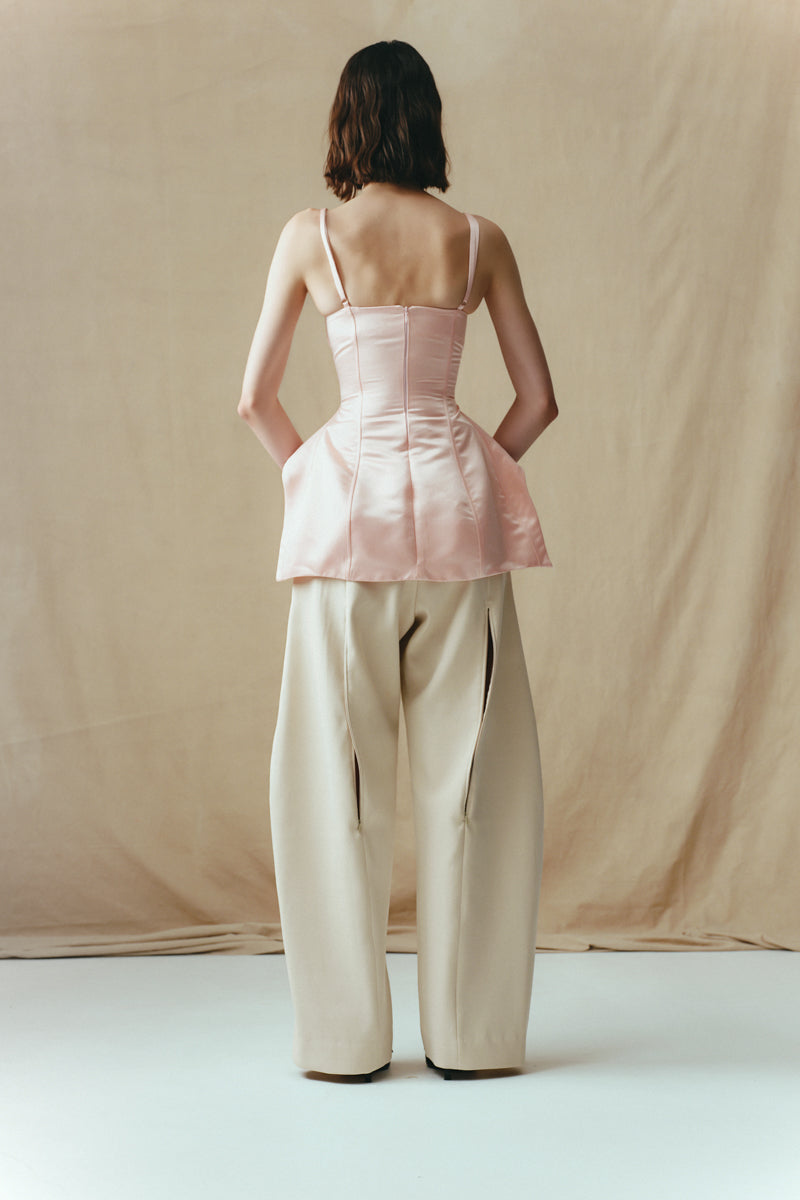 Sean Sheila blush corset top shown from the back, featuring fitted design and delicate details in a stylish tops collection.