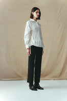Side view of Sean Sheila white corset-paneled shirt, showcasing structured design and fitted silhouette.
