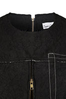 Black crinkled top by Sean Sheila, showcasing textured fabric and stylish design, perfect for casual or chic outfits.