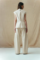 Sean Sheila eggshell vest with a single hook, stylish sleeveless top featuring a clean design and back view.