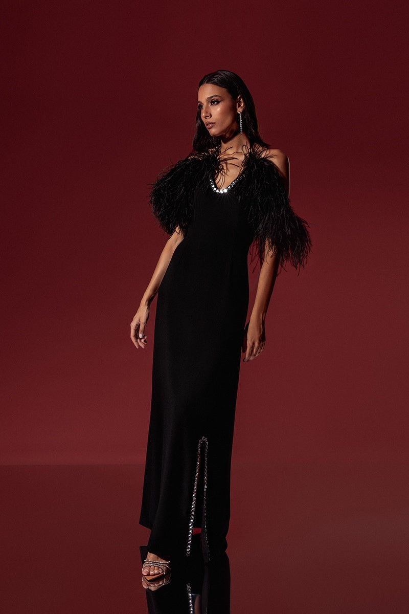 Black crepe embroidered feather gown by Monika Dimova, featuring intricate detailing and elegant feather accents.