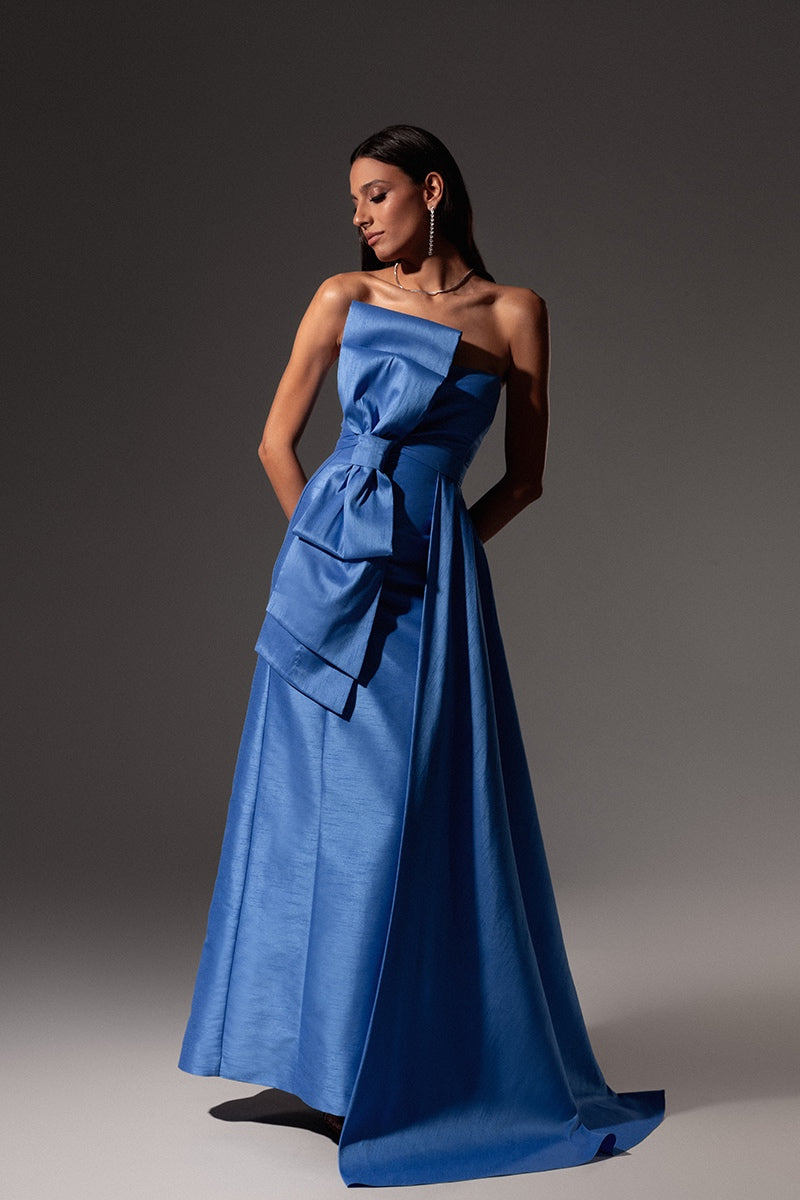 Royal blue Monika Dimova gown with shantung fabric and bow detail, featuring elegant design and intricate craftsmanship.