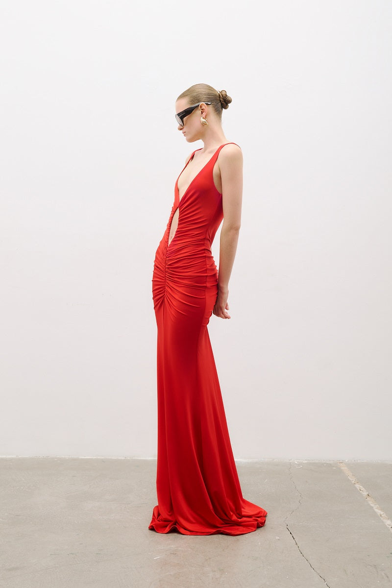 Red AWAVE strappy maxi dress with drape detailing, showcasing elegant flowing fabric and stylish design.