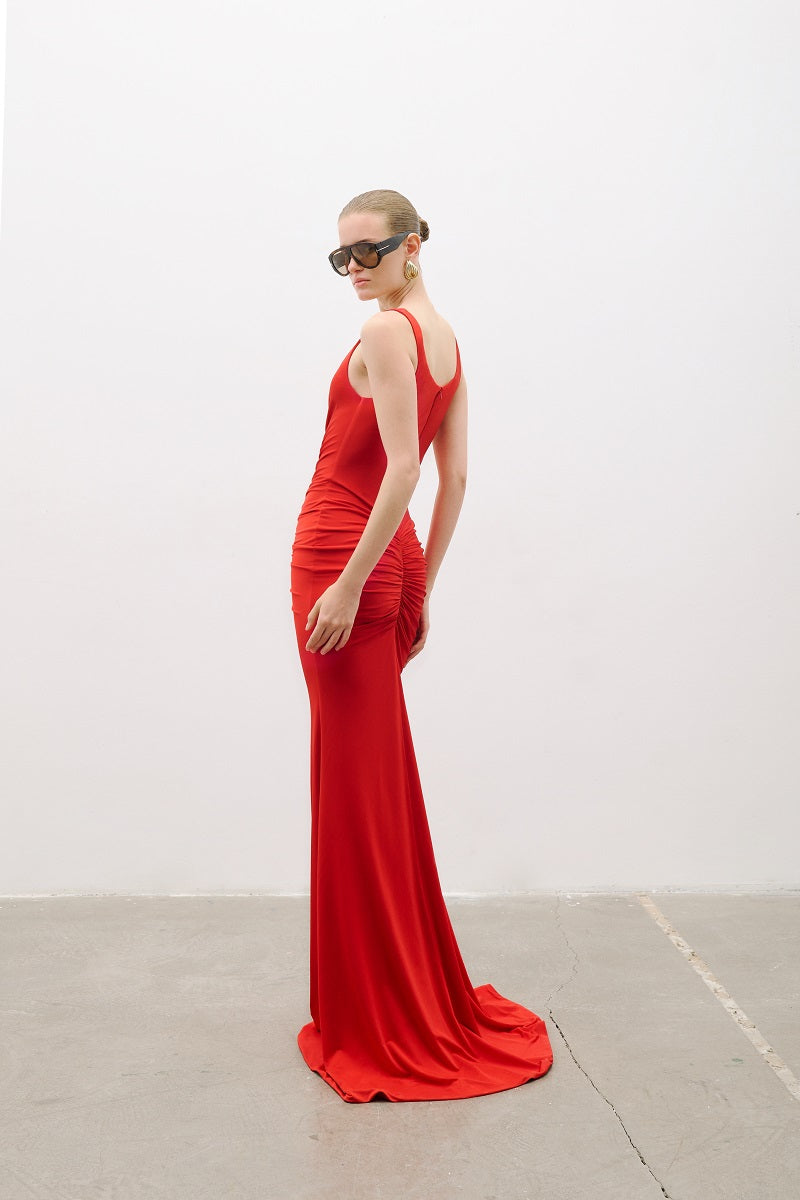 Red AWAVE strappy maxi dress with drape detailing, featuring flowing fabric and elegant design, perfect for evening wear.