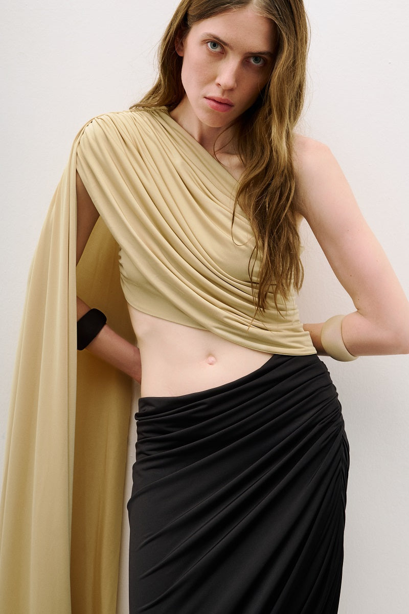 Black and gold detailed draped midi dress by AWAVE, featuring elegant fabric and intricate design details.