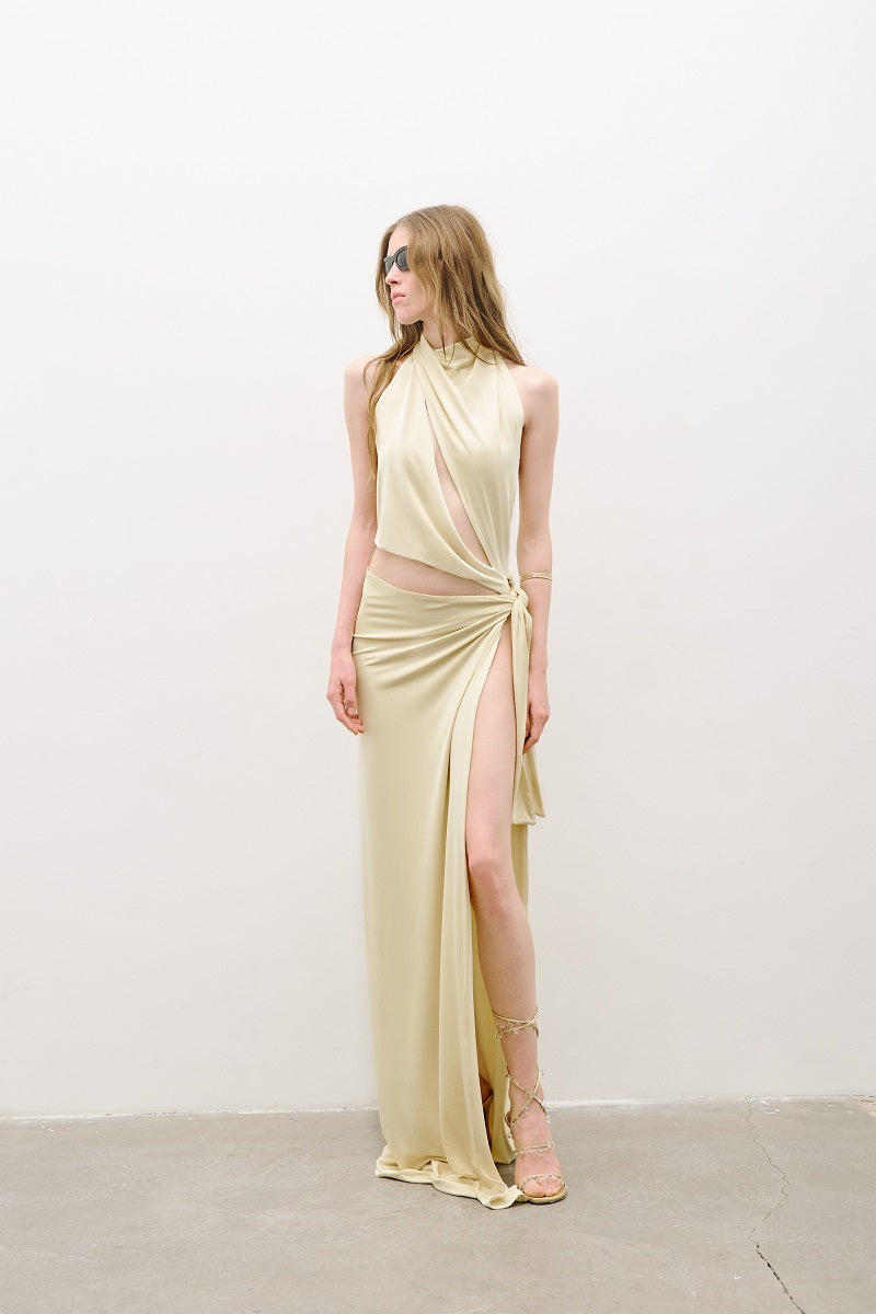 Butter yellow AWAVE maxi dress with cut-out detailing and a flowing silhouette, shown on a model.