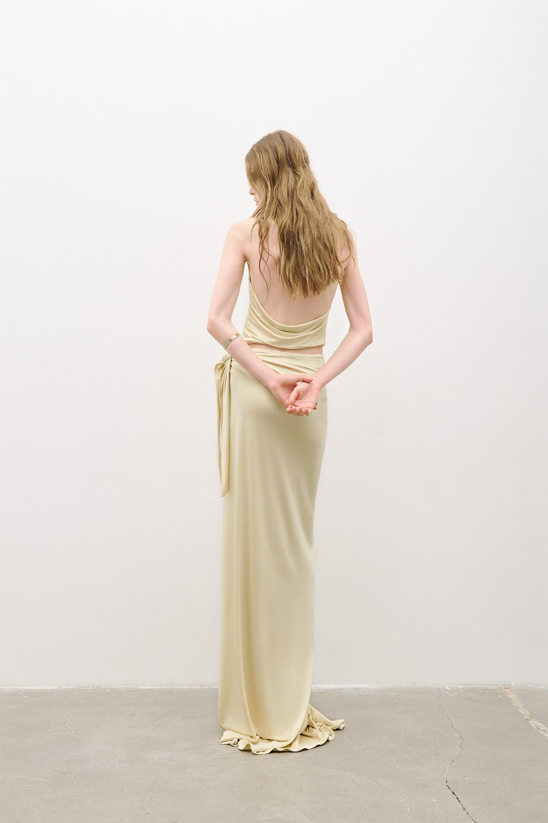 Bright butter yellow AWAVE maxi dress with cut-out detailing, flowing silhouette, and elegant style.
