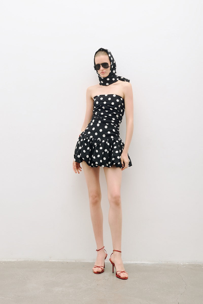 AWAVE ruched strapless mini dress with a balloon skirt, showcasing a fitted bodice and playful, voluminous skirt design.