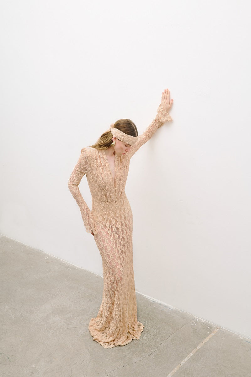 Light pink salmon long sleeve maxi dress by AWAVE, flowing fabric, elegant design, and full-length silhouette.