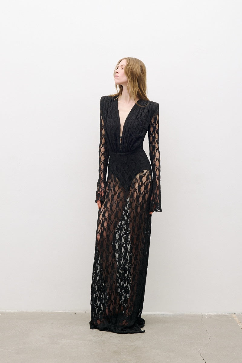 Black long-sleeved maxi dress by AWAVE featuring a flowing silhouette and elegant design, perfect for formal or casual wear.