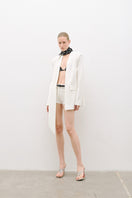 AWAVE suit set featuring a stylish jacket with a detachable shawl collar and matching mini shorts, modern and chic ensemble.