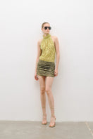 AWAVE turtleneck bodysuit with draped mini skirt, stylish and form-fitting, shown in a close-up fashion shot.