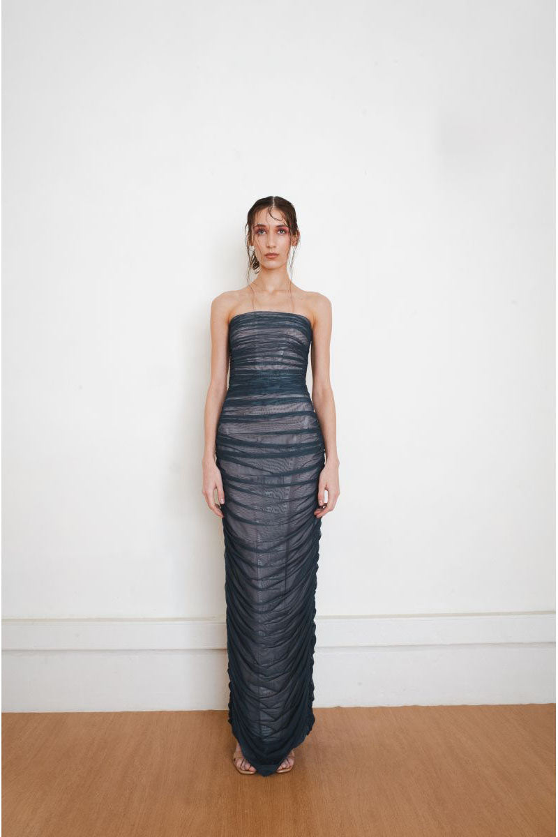 Teal fade maxi gown by YASSMIN SALEH featuring a flowing design and elegant neckline, front view.