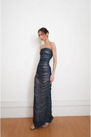 Side view of YASSMIN SALEH FADE GOWN in teal, a stylish maxi dress with a flowing design and elegant fade pattern.
