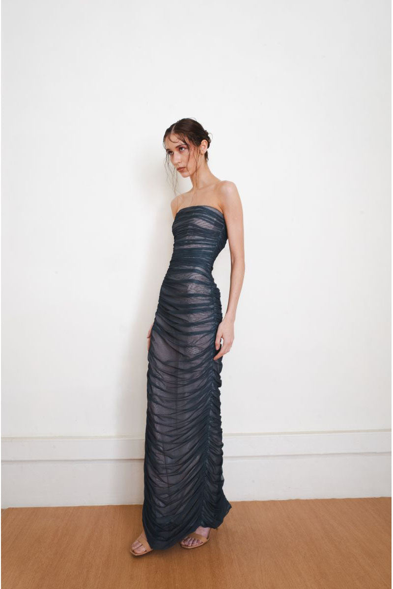 Side view of YASSMIN SALEH FADE GOWN in teal, a stylish maxi dress with a flowing design and elegant fade pattern.