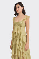 Green fairy-themed mini top by Stolen Stores, featuring a stylish cropped design with fairy graphics on the front.