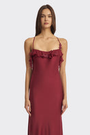 Elegant burgundy fairy ruffle maxi dress by Stolen Stores, featuring flowing fabric and delicate ruffle details.