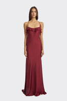 Elegant burgundy fairy ruffle maxi dress by Stolen Stores, featuring flowing fabric and intricate ruffle details.