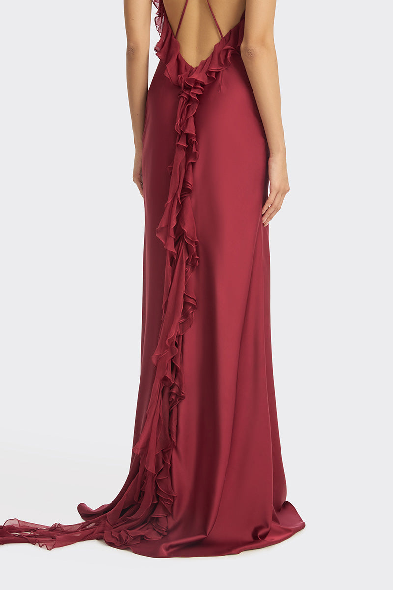 Elegant burgundy fairy ruffle maxi dress by Stolen Stores, featuring flowing fabric and delicate ruffle details.