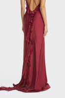 Elegant burgundy fairy ruffle maxi dress by Stolen Stores, featuring flowing fabric and delicate ruffle details.