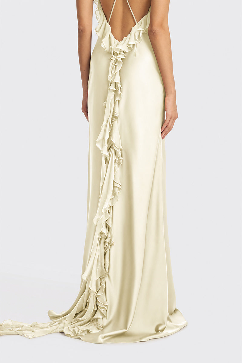 Light yellow fairy ruffle maxi dress by Stolen Stores featuring flowing fabric and delicate ruffle details.