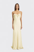 Light yellow fairy ruffle maxi dress by Stolen Stores featuring flowing fabric and delicate ruffle details.