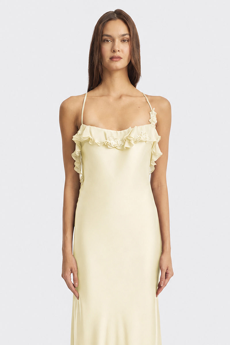 Light yellow fairy ruffle maxi dress by Stolen Stores, flowing gown with delicate ruffle details and a soft, elegant silhouette.