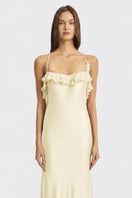 Light yellow fairy ruffle maxi dress by Stolen Stores, flowing gown with delicate ruffle details and a soft, elegant silhouette.