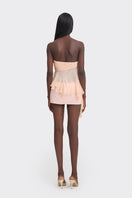 Peach fairy tube top by Stolen Stores featuring a fitted design and delicate fabric, perfect for casual or stylish summer outfits.