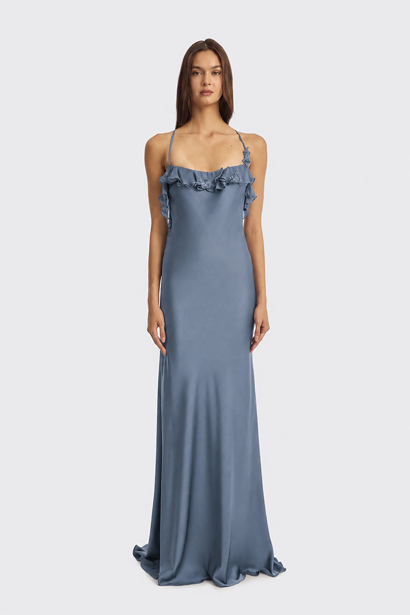 Dusty blue fairy ruffle maxi dress by Stolen Stores from the CULT MIA X Stolen Stores collection, featuring flowing fabric and ruffle details.