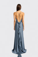 Dusty blue fairy ruffle maxi dress by Stolen Stores, featuring flowing fabric and elegant design for special occasions.