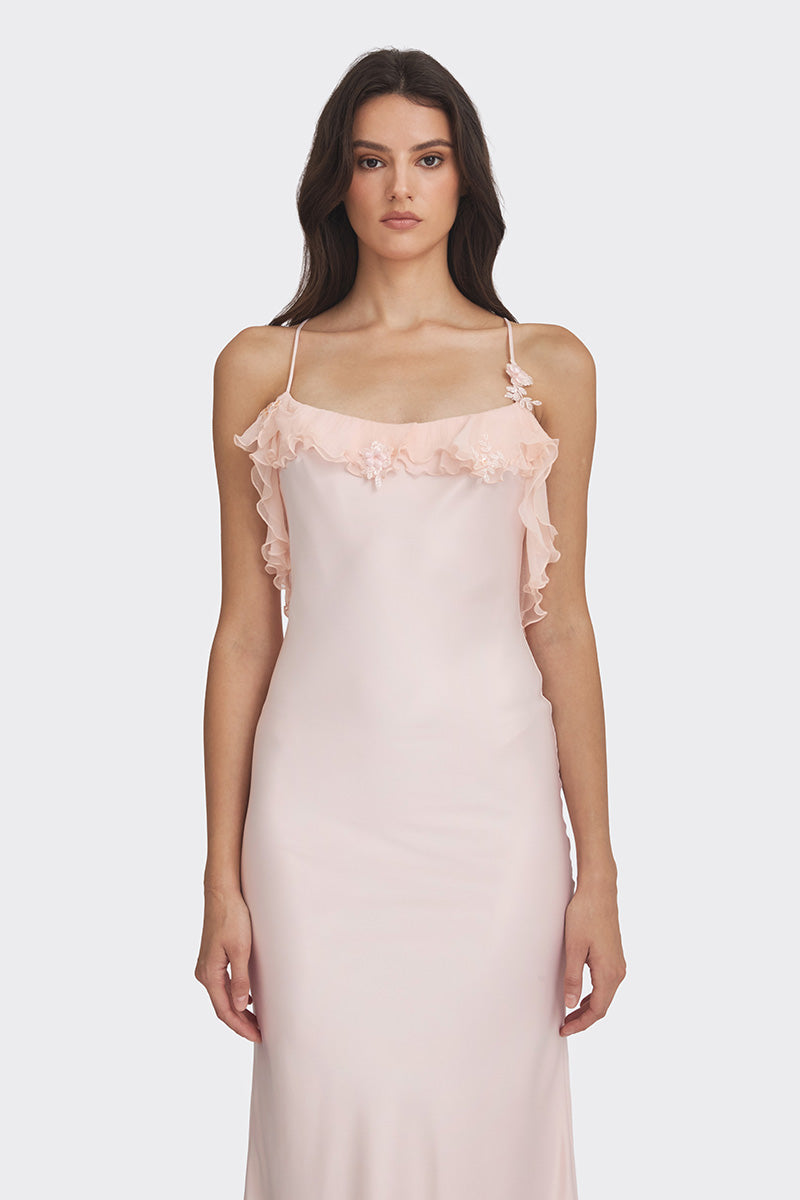 Light pink fairy ruffle maxi dress by Stolen Stores, flowing gown with layered ruffles and elegant design.