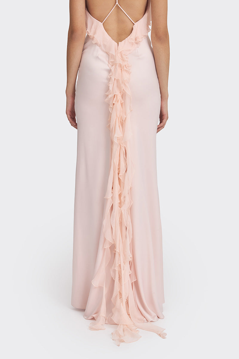 Light pink fairy ruffle maxi gown by Stolen Stores, flowing fabric with ruffle details, perfect for elegant occasions.