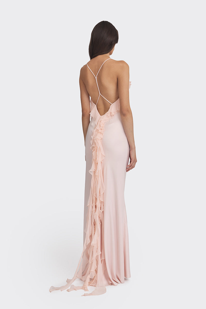 Light pink Fairy Ruffle Maxi Dress by Stolen Stores, flowing gown with ruffle details, perfect for elegant occasions.