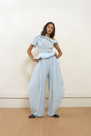 Blue Falling Pants by Yassmin Saleh, front view showing relaxed fit and stylish design.