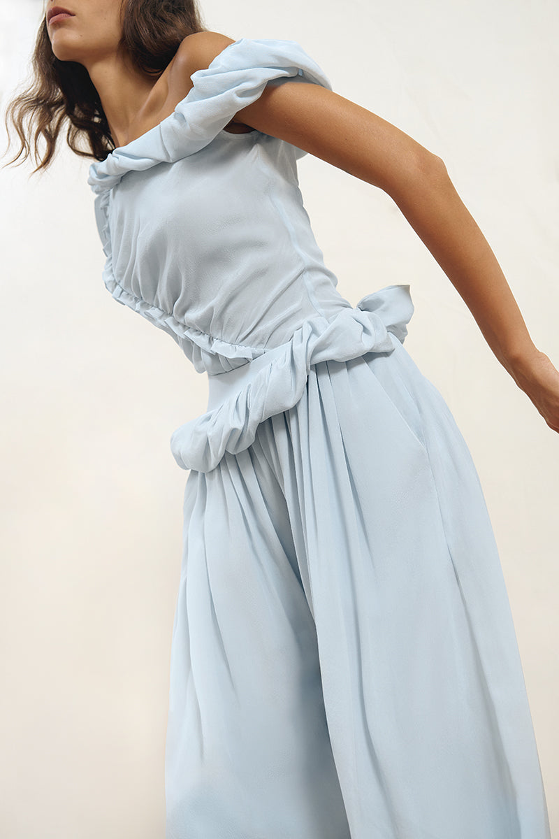 Blue Falling Pants by YASSMIN SALEH featuring a relaxed fit and stylish design, displayed on a model in a casual setting.