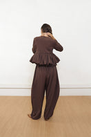 Brown Falling Pants by Yassmin Saleh, stylish and comfortable pants with a relaxed fit, shown from the back.