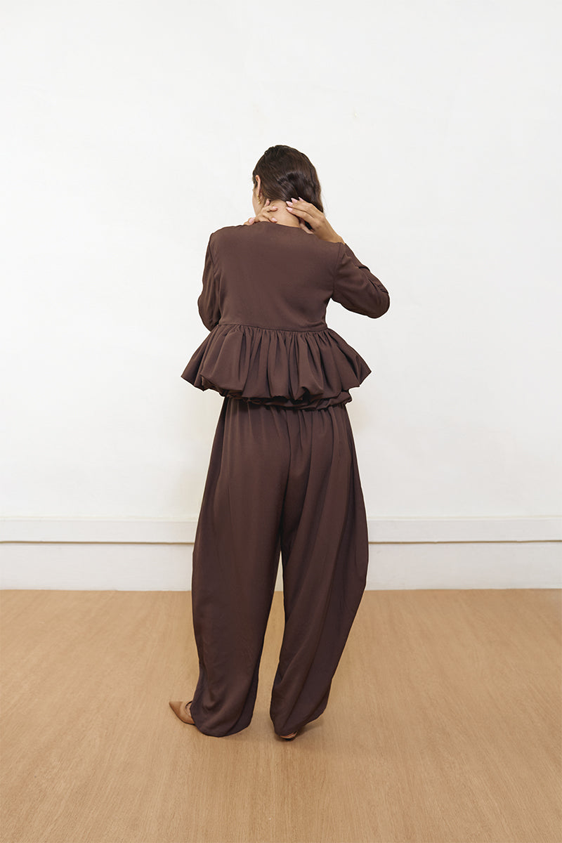 Brown Falling Pants by Yassmin Saleh, stylish and comfortable pants with a relaxed fit, shown from the back.