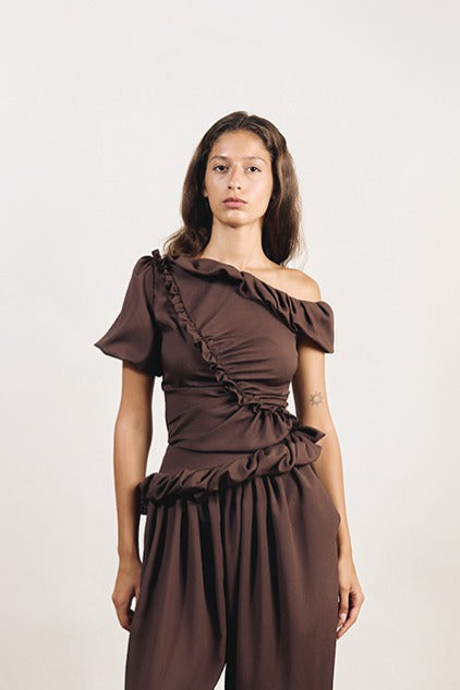 YASSMIN SALEH brown DREAM shirt tops displayed from the front, showcasing its relaxed fit and stylish design.
