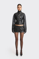 Black faux leather racing belt jacket from Stolen Stores featuring a stylish, fitted design with belt details and racing-inspired accents.