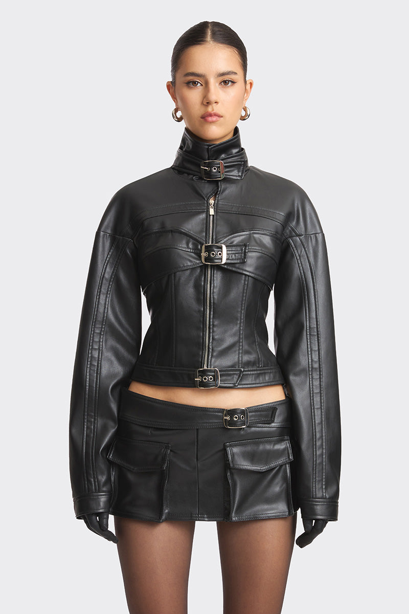 Black faux leather racing belt jacket by Stolen Stores featuring a stylish design with racing belt details and stud accents.