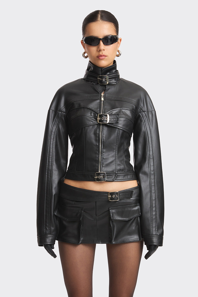 Black faux leather racing belt jacket for women by Stolen Stores, featuring a stylish racing belt design and sleek fit.