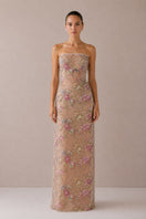 Nihan Peker beige Fay gown with elegant draping and long sleeves, displayed on a mannequin.
