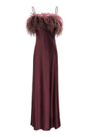 Elegant burgundy red feather long gown by MANITO, featuring flowing silk fabric and intricate feather detailing.