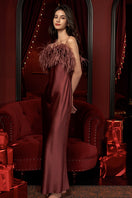 Elegant burgundy red feather long gown by MANITO, featuring flowing silk fabric and intricate feather details.